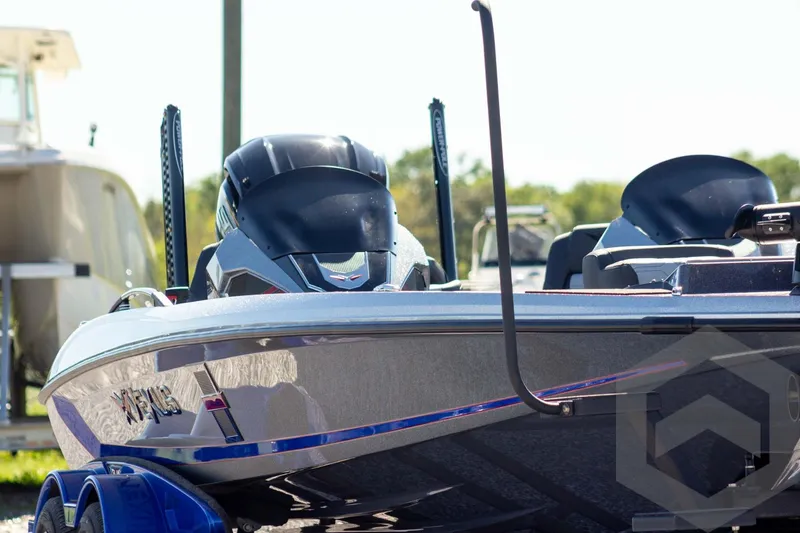 Slide: The Image of 2026 Vexus VXs21 boat with sleek design and modern features, parked outdoors. - 3