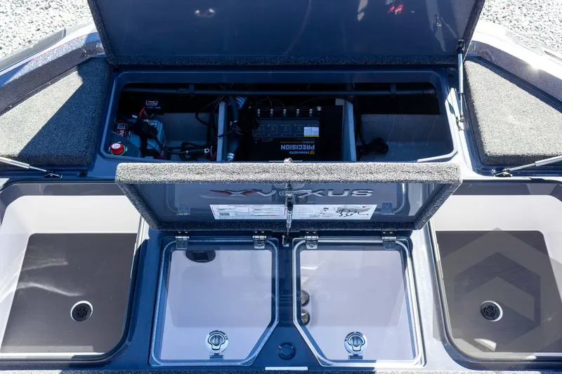 Slide: The Image of 2026 Vexus VXs21 boat storage compartments and battery setup. - 36
