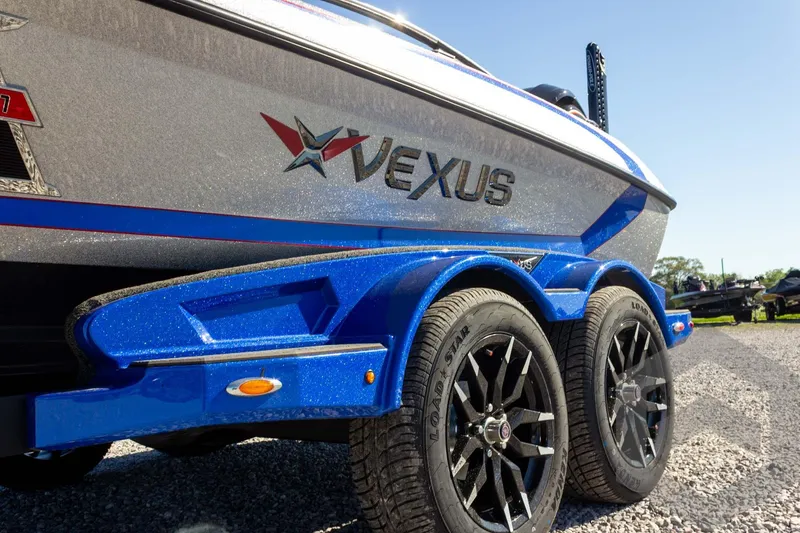 Slide: The Image of 2026 Vexus VXs21 boat on trailer, featuring sleek design and vibrant blue accents. - 42