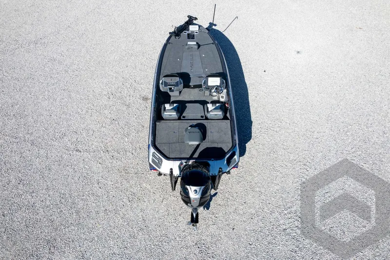 Slide: The Image of 2026 Vexus VXs21 boat, aerial view on gravel surface, showcasing sleek design and modern features. - 51