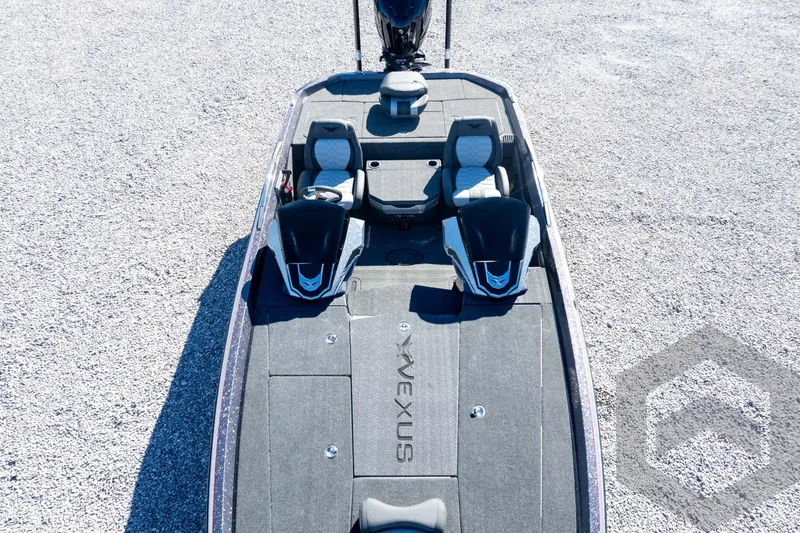 Slide: The Image of 2026 Vexus VXs21 boat with dual seats on gravel surface. - 56