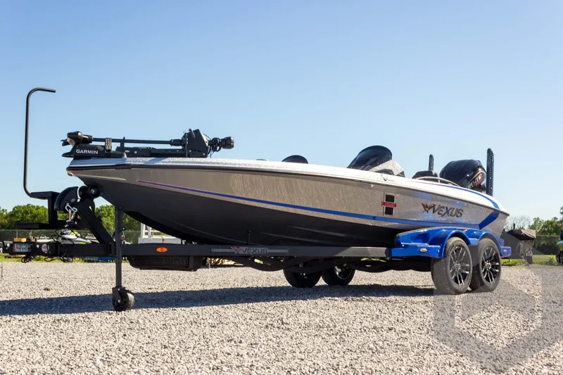 Slide: The Image of 2026 Vexus VXs21 boat on trailer, featuring sleek design and Garmin equipment. - 6