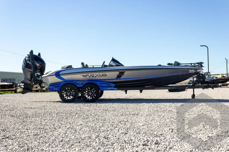 Slide: The Image of 2026 Vexus VXs21 boat on trailer, side view, parked on gravel. - 9