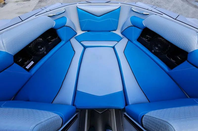 Slide: The Image of Blue and gray interior seating of 2022 Supreme S220 boat model. - 11