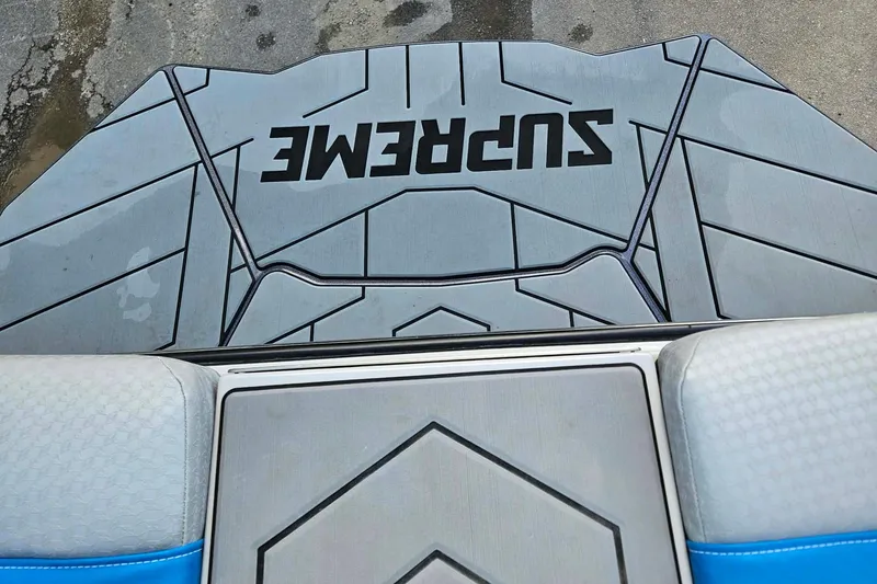 Slide: The Image of 2022 Supreme S220 boat deck with logo and geometric design. - 13