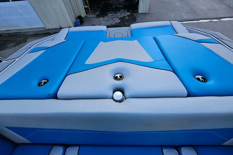 Slide: The Image of Blue and gray upholstery on 2022 Supreme S220 boat, showcasing sleek design and craftsmanship. - 16