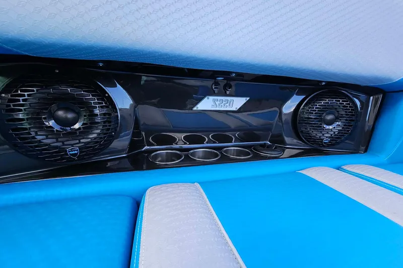 Slide: The Image of Interior of 2022 Supreme S220 boat with speakers and cup holders. - 17