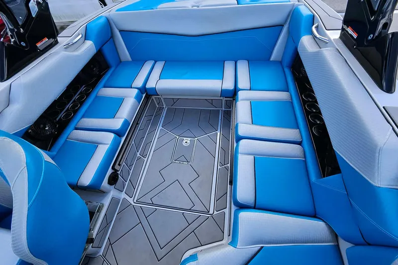 Slide: The Image of Luxurious blue interior of 2022 Supreme S220 boat with spacious seating. - 19