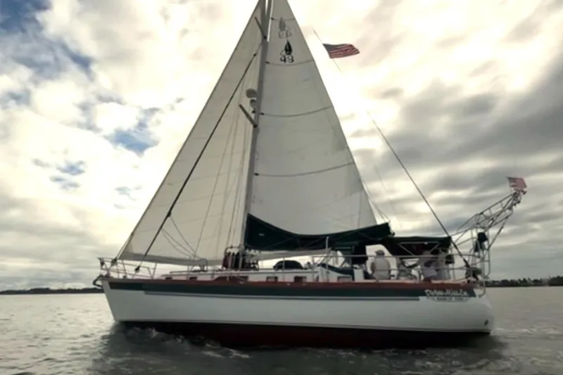 The Image of Sailing yacht Slocum 43 from 1990 on open water under cloudy skies. - 0