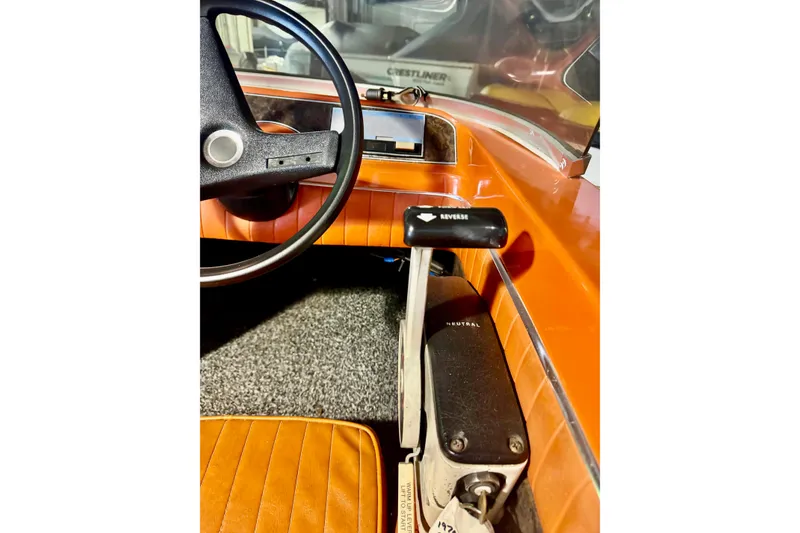 Slide: The Image of 1971 Glastron/Carlson GT 15 boat interior with steering wheel and gear shift lever. - 10