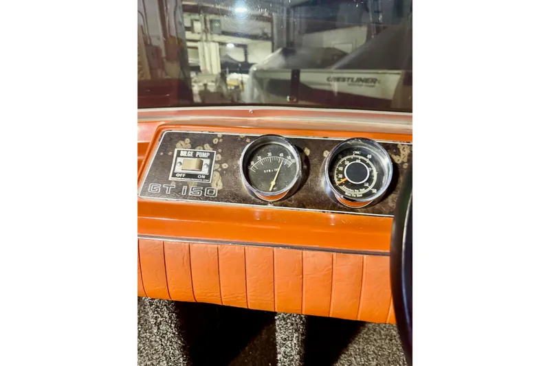 Slide: The Image of 1971 Glastron/Carlson GT 15 dashboard with bilge pump switch and gauges. - 11