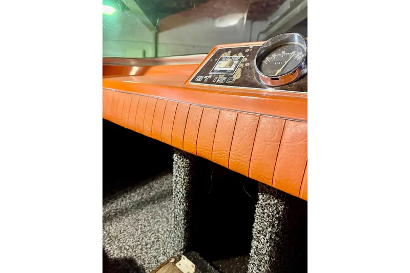 Slide: The Image of 1971 Glastron/Carlson GT 15 dashboard with vintage gauges and orange trim. - 12