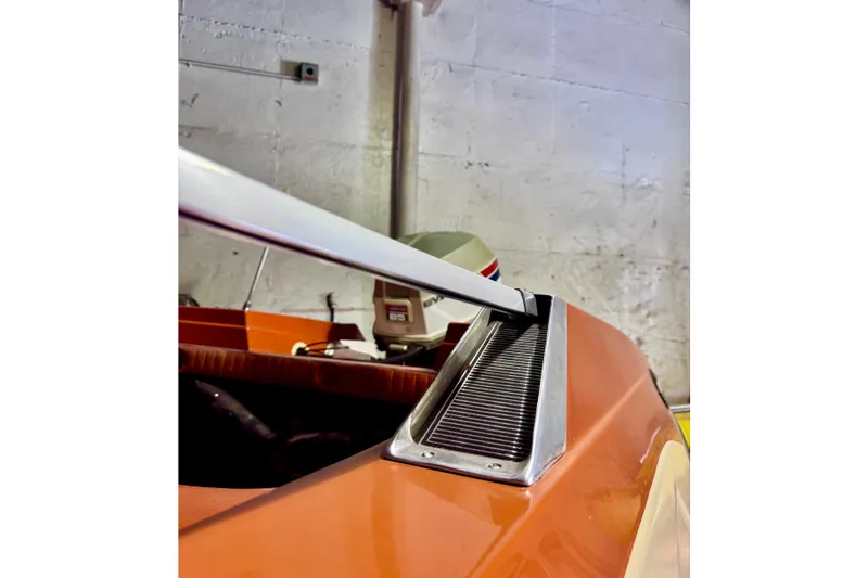 Slide: The Image of 1971 Glastron/Carlson GT 15 boat detail with orange exterior and sleek design. - 19
