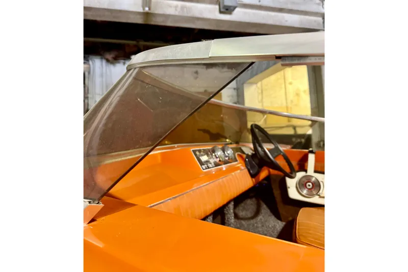 Slide: The Image of 1971 Glastron/Carlson GT 15 boat interior with orange dashboard and steering wheel. - 20