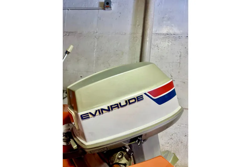 Slide: The Image of 1971 Glastron/Carlson GT 15 with Evinrude outboard motor in a garage setting. - 21