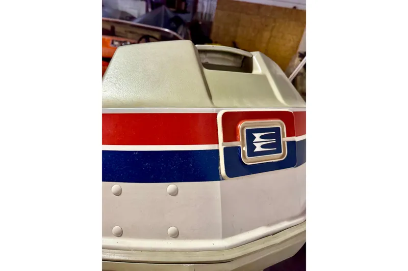 Slide: The Image of 1971 Glastron/Carlson GT 15 boat with red, white, and blue detailing. - 23