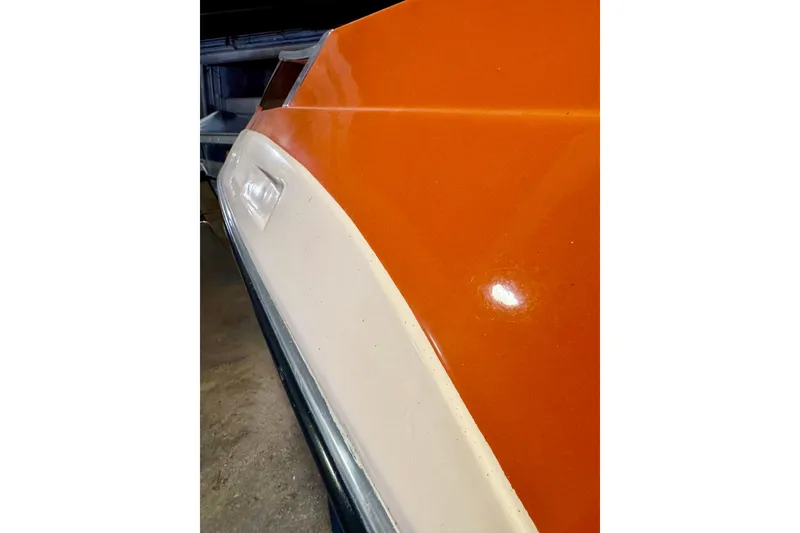 Slide: The Image of 1971 Glastron/Carlson GT 15 boat with orange and white exterior detail. - 25