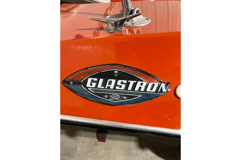 Slide: The Image of 1971 Glastron/Carlson GT 15 boat emblem on vibrant orange surface. - 3
