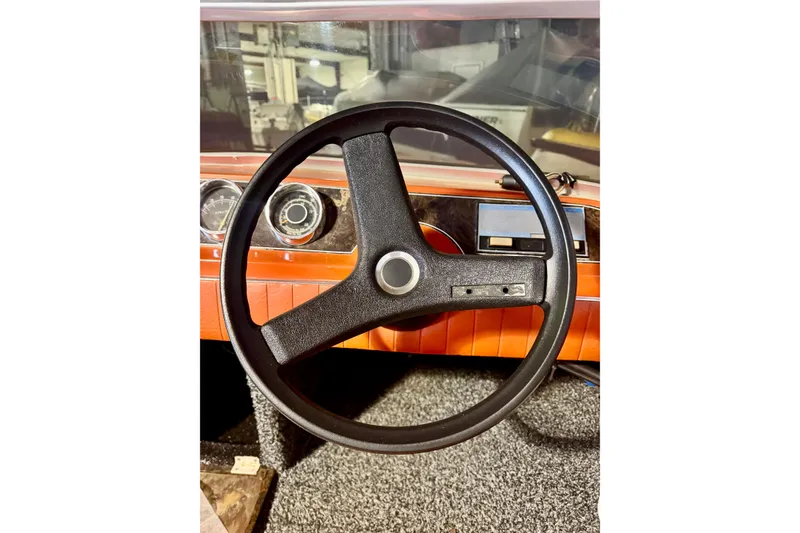 Slide: The Image of 1971 Glastron/Carlson GT 15 dashboard with classic steering wheel and gauges. - 9