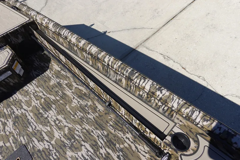 Slide: The Image of 2026 Avid 18 Commander boat with camouflage interior design. - 15