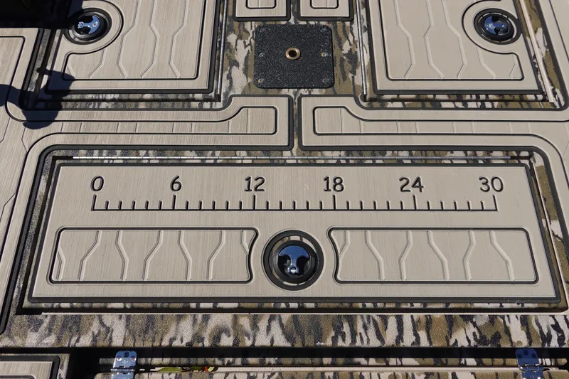 Slide: The Image of 2026 Avid 18 Commander boat deck with integrated ruler and camo pattern. - 21