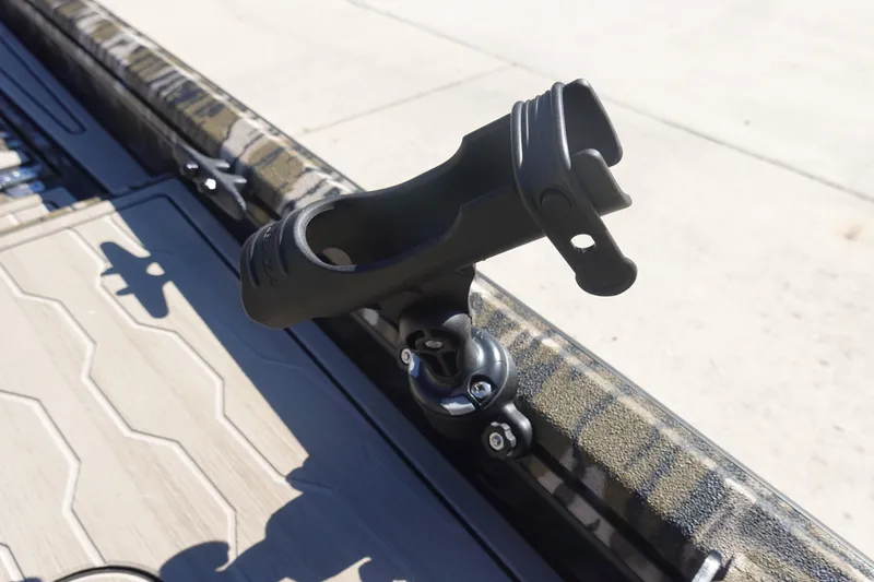Slide: The Image of Rod holder on 2026 Avid 18 Commander boat deck, featuring camouflage design. - 26