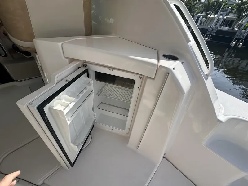 Slide: The Image of 2008 Tiara Yachts 3500 Sovran with open mini fridge on deck. - 10
