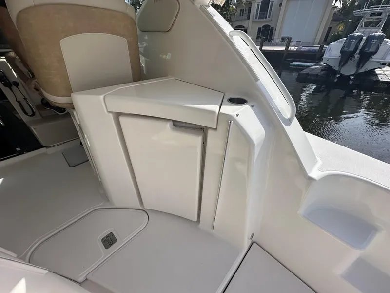 Slide: The Image of 2008 Tiara Yachts 3500 Sovran interior detail with seating and storage compartment. - 11