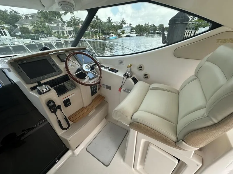 Slide: The Image of 2008 Tiara Yachts 3500 Sovran helm with leather seat and modern controls. - 4