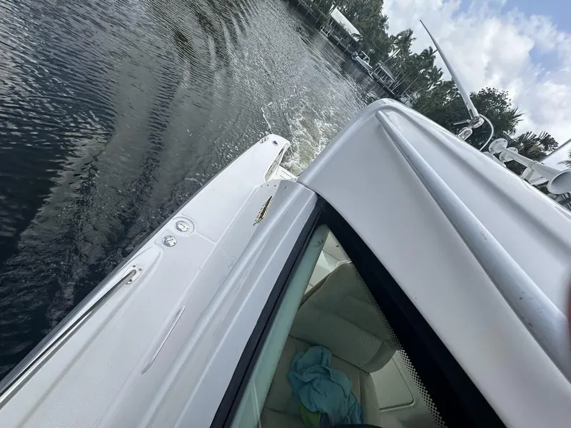 Slide: The Image of 2008 Tiara Yachts 3500 Sovran cruising on calm waters under a partly cloudy sky. - 43