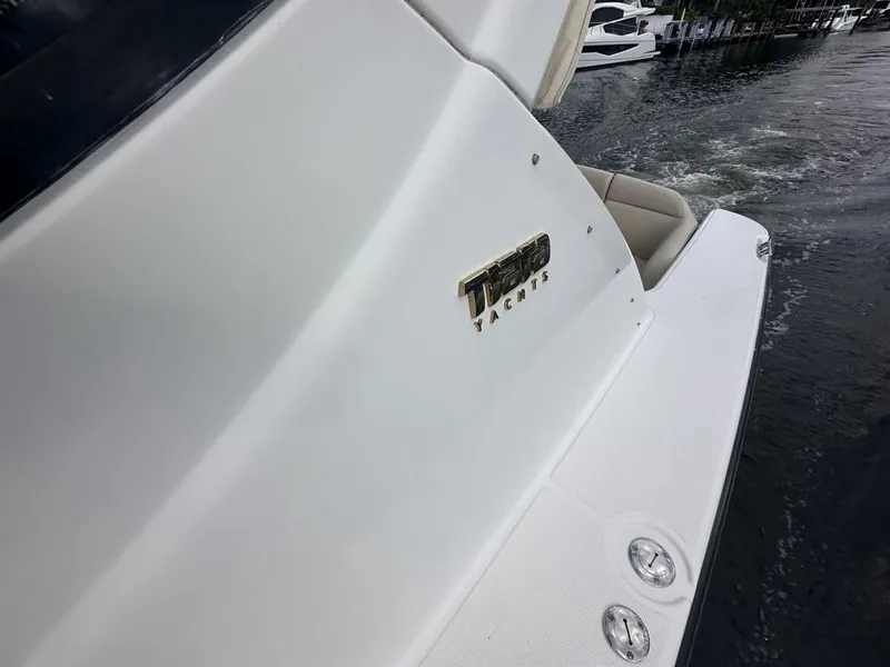 Slide: The Image of 2008 Tiara Yachts 3500 Sovran on water, showcasing sleek design and branding. - 47