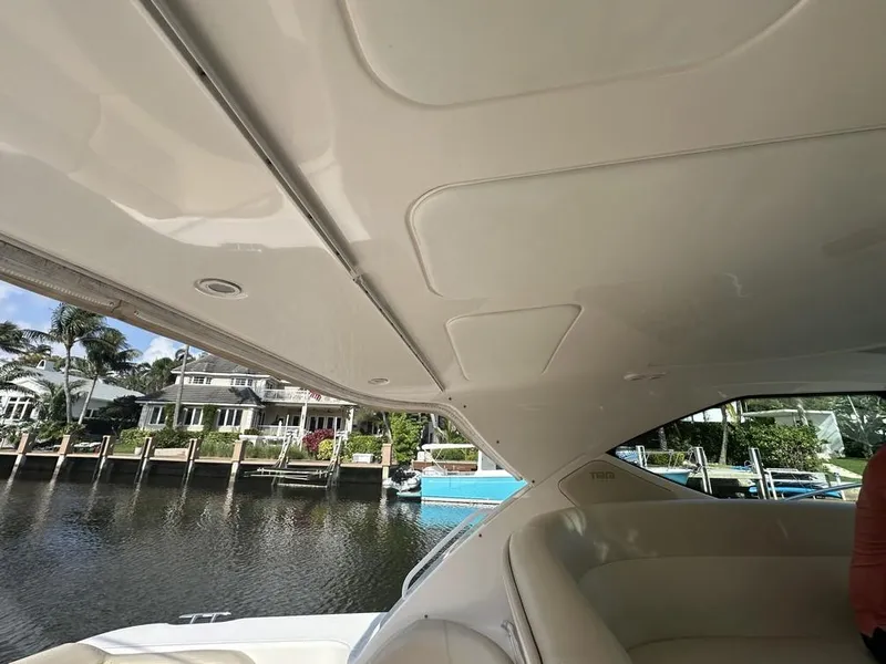 Slide: The Image of 2008 Tiara Yachts 3500 Sovran interior view with waterfront background. - 8