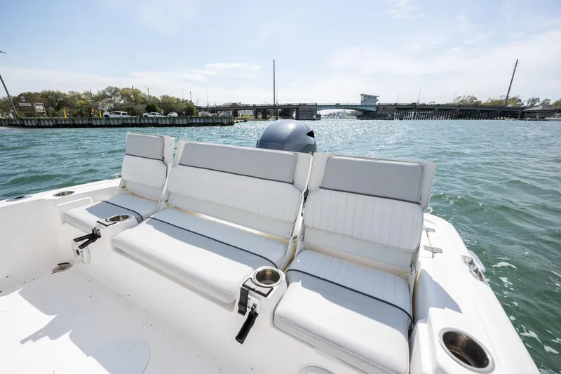 Slide: The Image of 2019 Sea Fox 220 Viper boat with cushioned seating on open water. - 10