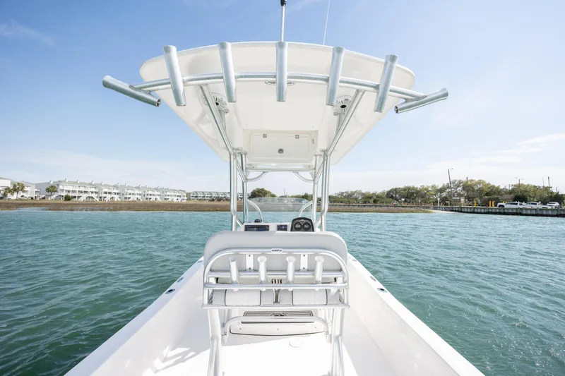 Slide: The Image of 2019 Sea Fox 220 Viper boat on water, featuring center console and T-top. - 12