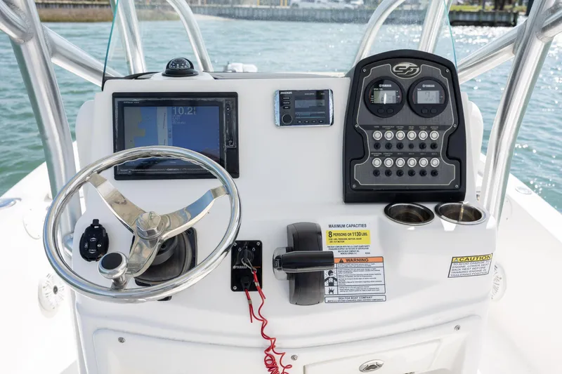 Slide: The Image of 2019 Sea Fox 220 Viper boat dashboard with steering wheel and control panel. - 14