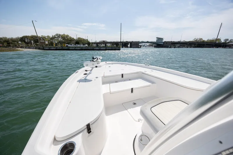 Slide: The Image of 2019 Sea Fox 220 Viper boat on water near a bridge under clear skies. - 16