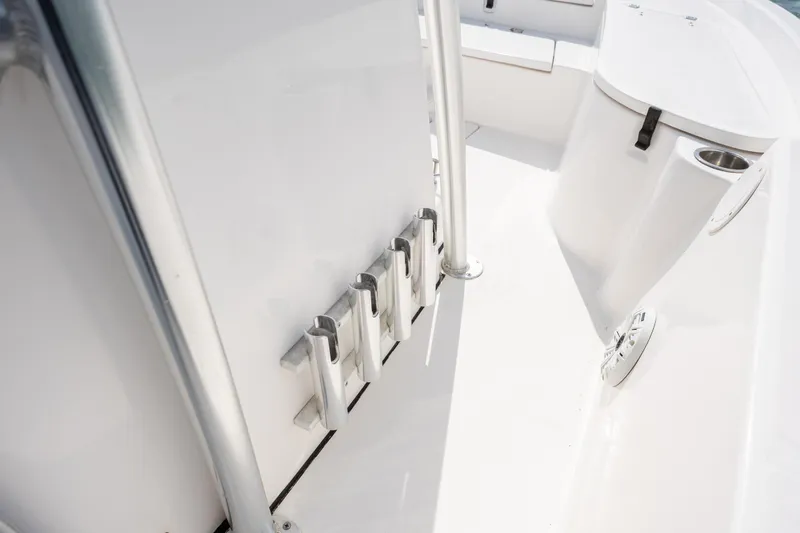 Slide: The Image of 2019 Sea Fox 220 Viper boat interior with rod holders and cup holder. - 23