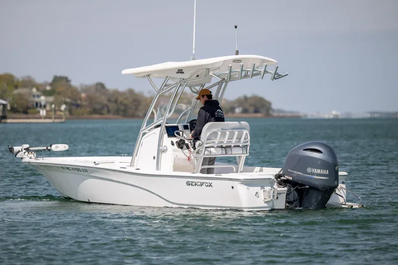 Slide: The Image of 2019 Sea Fox 220 Viper boat cruising on calm waters with Yamaha outboard motor. - 5