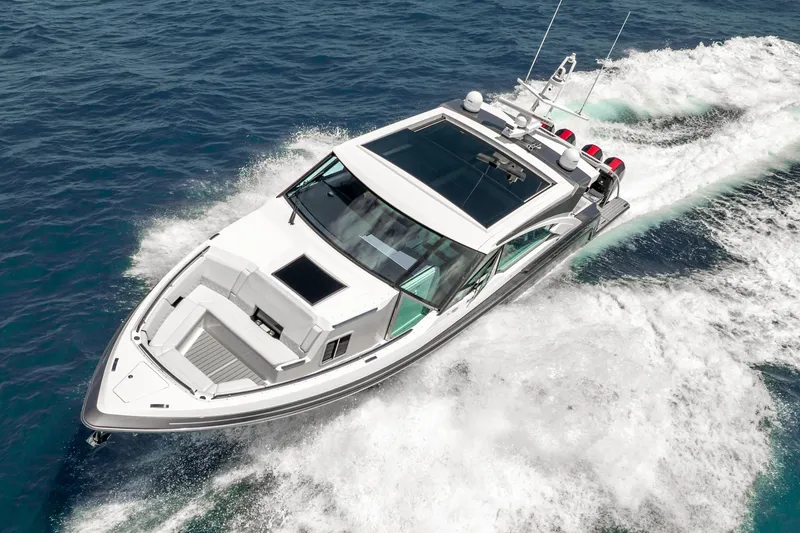 Slide: The Image of 2022 Formula 500 Super Sport Crossover cruising on open water, showcasing sleek design and performance. - 13