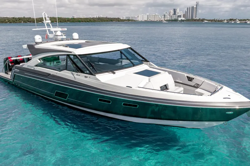 Slide: The Image of 2022 Formula 500 Super Sport Crossover yacht on clear blue water, city skyline in background. - 2