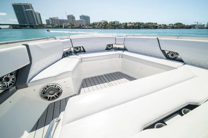 Slide: The Image of Luxurious seating area on 2022 Formula 500 Super Sport Crossover boat, with waterfront city view. - 26