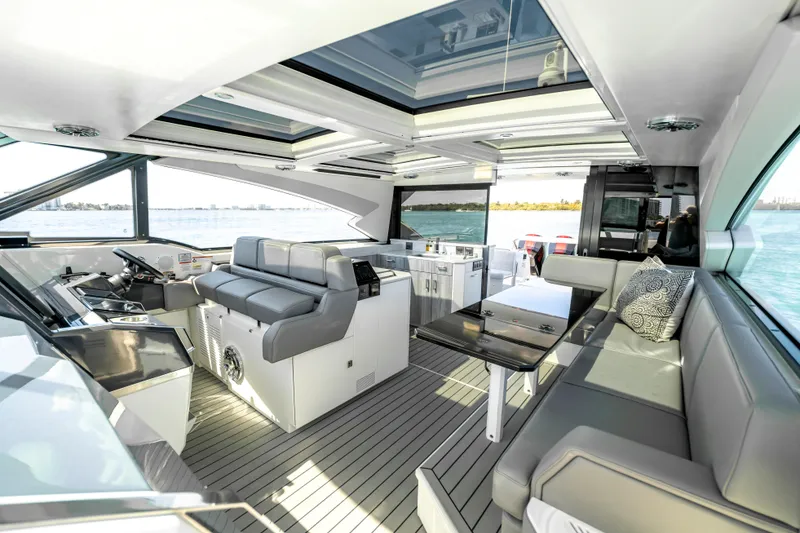 Slide: The Image of Luxurious interior of 2022 Formula 500 Super Sport Crossover yacht with modern seating and panoramic views. - 29