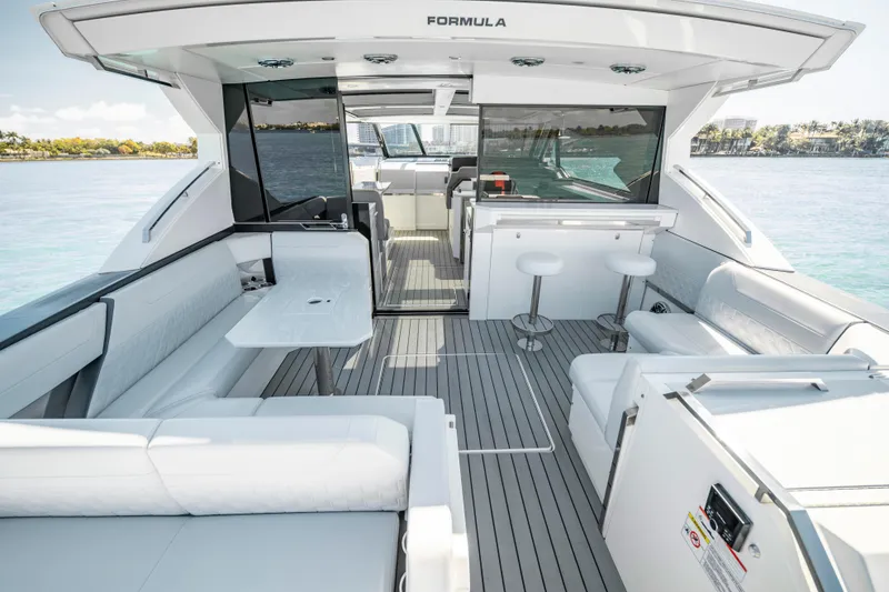 Slide: The Image of 2022 Formula 500 Super Sport Crossover luxury yacht interior with seating and ocean view. - 32