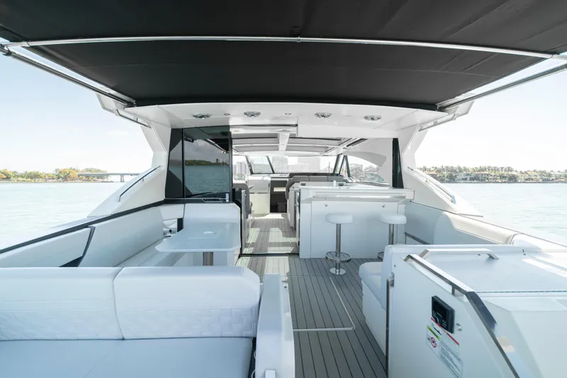 Slide: The Image of Luxurious 2022 Formula 500 Super Sport Crossover yacht interior with modern seating and sleek design. - 45