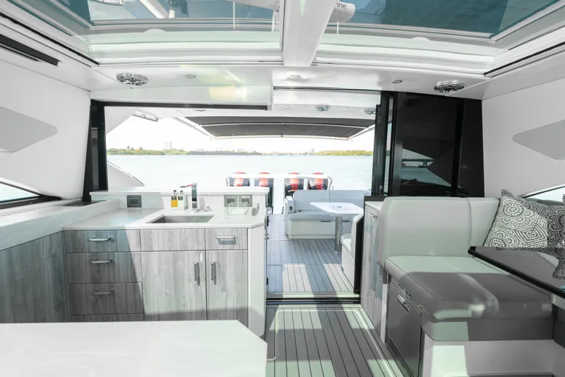 Slide: The Image of Luxurious interior of 2022 Formula 500 Super Sport Crossover yacht with modern kitchen and seating. - 48