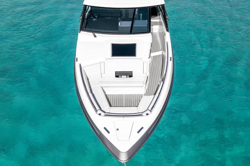Slide: The Image of 2022 Formula 500 Super Sport Crossover boat on clear turquoise water. - 5