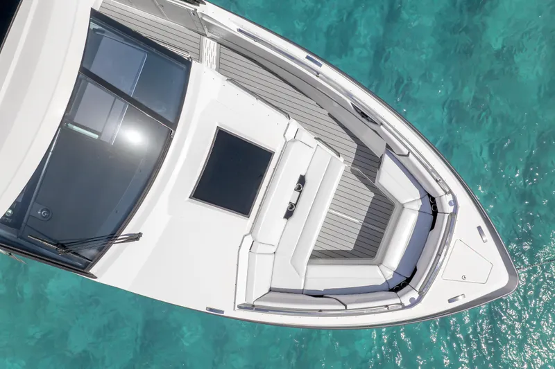 Slide: The Image of 2022 Formula 500 Super Sport Crossover boat on clear turquoise water, top view. - 6
