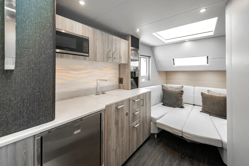 Slide: The Image of Modern interior of 2022 Formula 500 Super Sport Crossover yacht with kitchenette and seating area. - 62