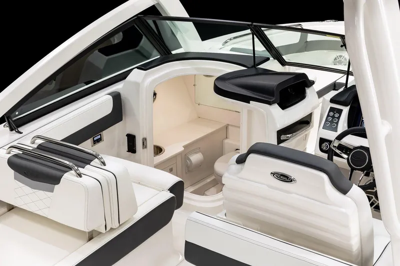 Slide: The Image of Manufacturer Provided Image: 2026 Robalo R277 Dual Console interior, featuring sleek seating and modern dashboard design. - 6