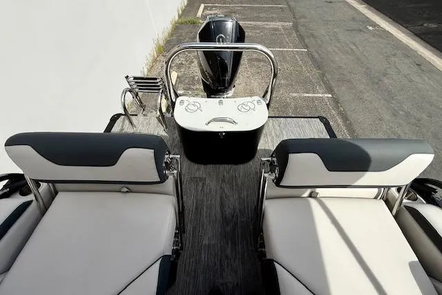 Slide: The Image of 2026 Avalon LSZ Quad Lounge Shift boat interior with dual seating and control console. - 10